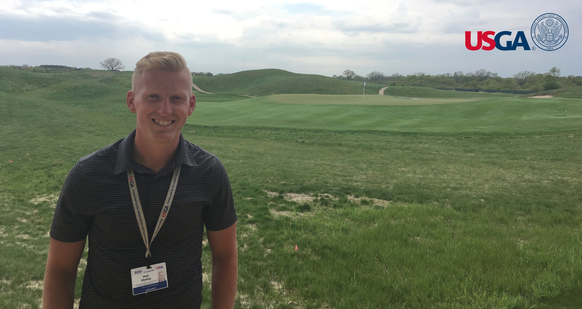 Sheeley (pictured) in front of the 13th green at Erin Hills, site of the 117th U.S. Open Championship.
